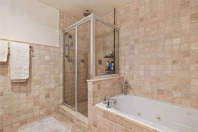 260 W Broadway Unit 2G, Long Beach, NY 11561 - bathroom with tile walls, a stall shower, and a tub with jets
