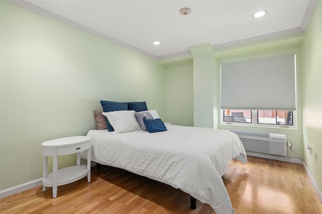 260 W Broadway Unit 2G, Long Beach, NY 11561 - bedroom featuring baseboards, crown molding, an AC wall unit, wood finished floors, and recessed lighting