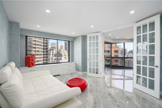 200 E 61st St Unit 19De, New York Manhattan, NY 10065 - living room featuring a city view, healthy amount of natural light, french doors, light marble finish floors, and recessed lighting