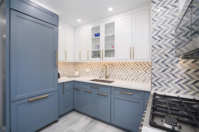 200 E 61st St Unit 19De, New York Manhattan, NY 10065 - kitchen featuring a sink, glass insert cabinets, tasteful backsplash, white cabinets, and recessed lighting