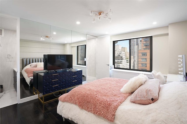 200 E 61st St Unit 19De, New York Manhattan, NY 10065 - bedroom with recessed lighting and wood finished floors