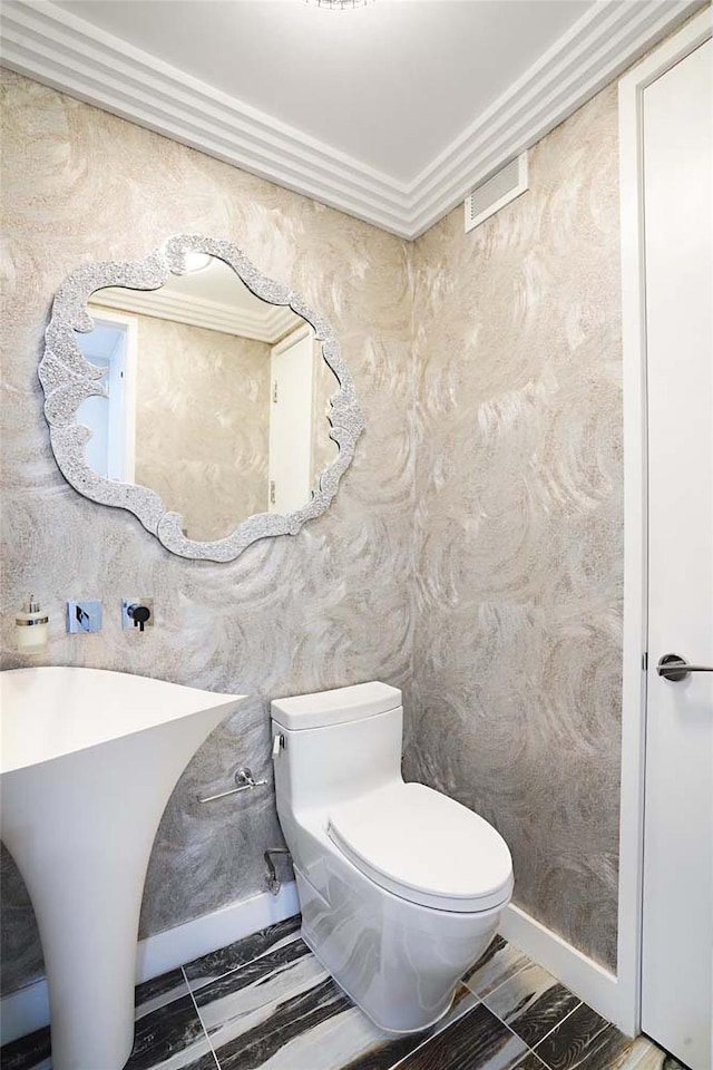 200 E 61st St Unit 19De, New York Manhattan, NY 10065 - bathroom with toilet and ornamental molding