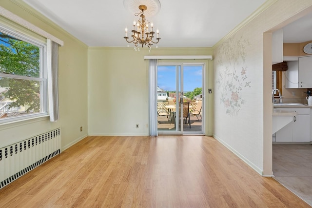 151AKA149 Stone Ave, Yonkers, NY 10701 - spare room featuring radiator, light wood-style flooring, a chandelier, and ornamental molding