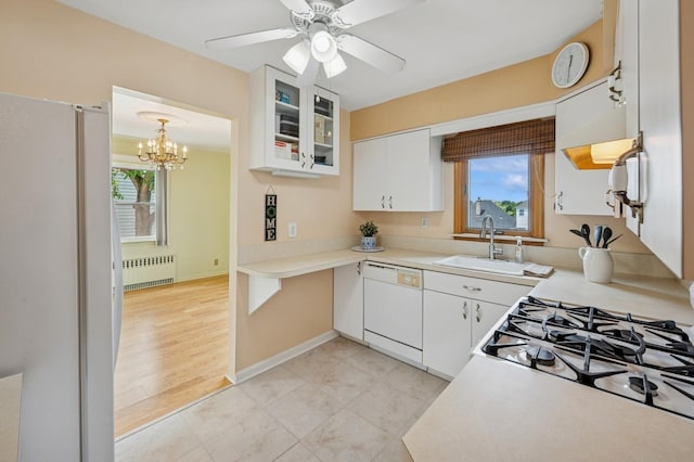 151AKA149 Stone Ave, Yonkers, NY 10701 - kitchen featuring radiator heating unit, white appliances, healthy amount of natural light, and white cabinets