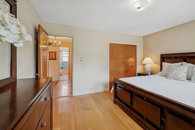151AKA149 Stone Ave, Yonkers, NY 10701 - bedroom featuring light wood-style floors, a chandelier, and a closet