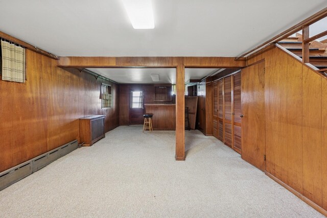 151AKA149 Stone Ave, Yonkers, NY 10701 - basement with wood walls, carpet flooring, and baseboard heating