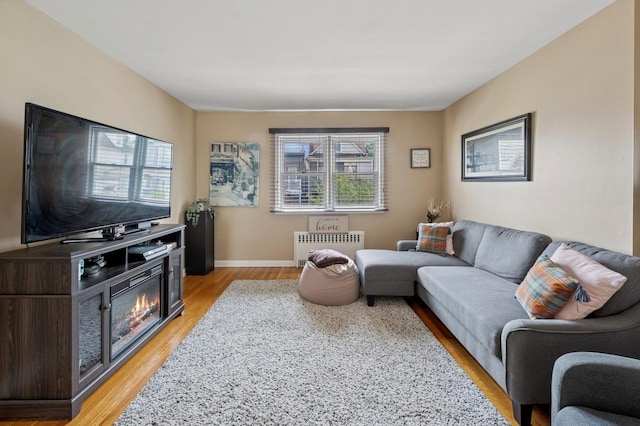151AKA149 Stone Ave, Yonkers, NY 10701 - living area with radiator and light wood-style flooring
