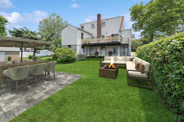 151AKA149 Stone Ave, Yonkers, NY 10701 - back of property with an outdoor living space with a fire pit, a patio area, and a lawn
