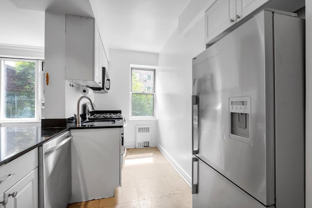 3750 Hudson Manor Ter Unit 1Dw, Bronx, NY 10463 - kitchen with appliances with stainless steel finishes, radiator, a sink, and plenty of natural light