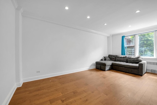 3750 Hudson Manor Ter Unit 1Dw, Bronx, NY 10463 - living room featuring radiator heating unit, ornamental molding, light wood-style floors, recessed lighting, and baseboards