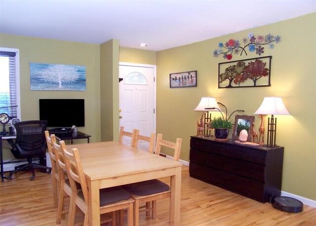 600 Fulton St Unit I-1, Farmingdale, NY 11735 - dining space featuring light wood-style floors and baseboards
