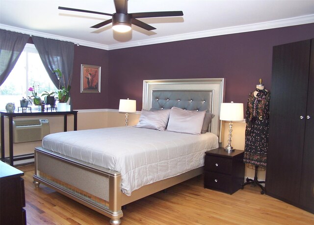600 Fulton St Unit I-1, Farmingdale, NY 11735 - bedroom with ornamental molding, wood finished floors, and a ceiling fan