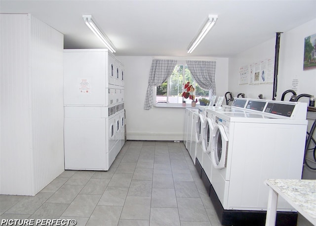 600 Fulton St Unit I-1, Farmingdale, NY 11735 - community laundry with stacked washer / drying machine, washing machine and clothes dryer, and light tile patterned floors