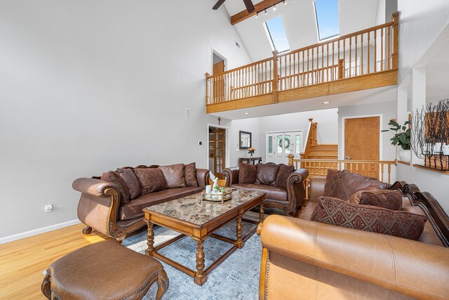 83 Mcdonald Rd, Ossining, NY 10562 - living area with high vaulted ceiling, wood finished floors, and beam ceiling