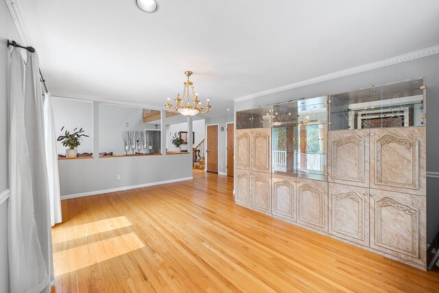 83 Mcdonald Rd, Ossining, NY 10562 - unfurnished room featuring a chandelier, wood finished floors, and stairway