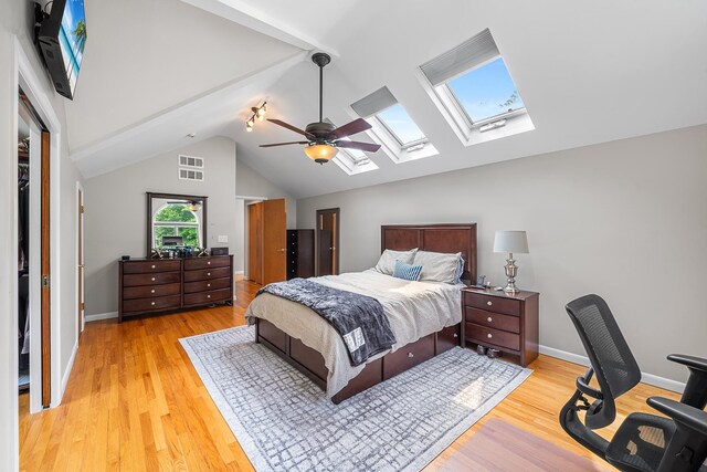 83 Mcdonald Rd, Ossining, NY 10562 - bedroom with a skylight, lofted ceiling, light wood-type flooring, a ceiling fan, and an office area