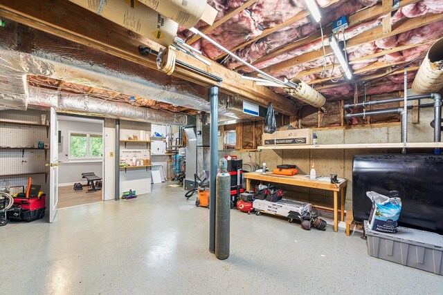83 Mcdonald Rd, Ossining, NY 10562 - basement with oil tank and a workshop area