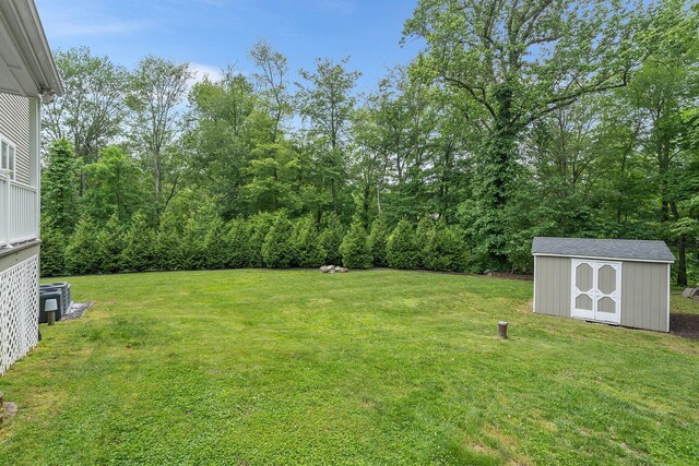 83 Mcdonald Rd, Ossining, NY 10562 - view of grassy yard with a storage unit