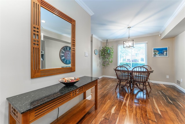 62 Alhambra Dr, Oceanside, NY 11572 - dining space featuring dark wood finished floors, baseboards, crown molding, and a chandelier