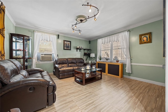 1363 Noble Ave, Bronx, NY 10472 - living area featuring crown molding, cooling unit, rail lighting, baseboards, and wood finished floors