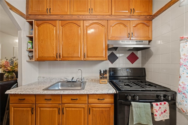 1363 Noble Ave, Bronx, NY 10472 - kitchen featuring black gas range oven, under cabinet range hood, a sink, and decorative backsplash