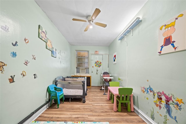 1363 Noble Ave, Bronx, NY 10472 - playroom featuring wood finished floors, ceiling fan, and cooling unit