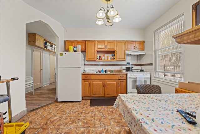 1363 Noble Ave, Bronx, NY 10472 - kitchen featuring white appliances, under cabinet range hood, open shelves, light countertops, and a chandelier
