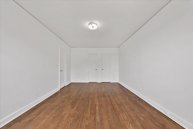 98-120 Queens Blvd Unit 5G, Rego Park, NY 11374 - unfurnished bedroom with wood finished floors and baseboards