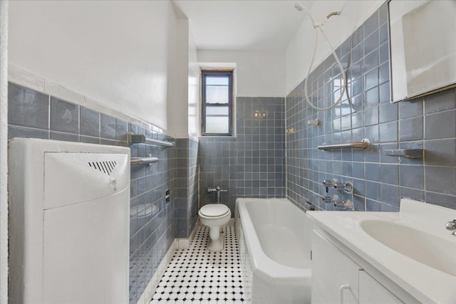 98-120 Queens Blvd Unit 5G, Rego Park, NY 11374 - bathroom featuring tile walls, a bath, toilet, tile patterned floors, and vanity