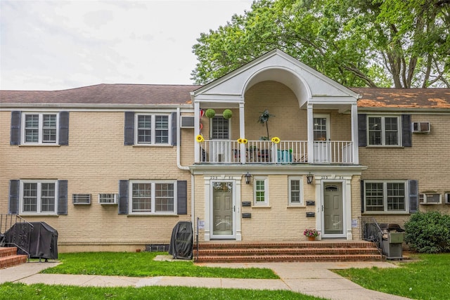 223-36 65th Ave Unit 2A, Bayside, NY 11364 - view of front facade featuring a balcony and brick siding
