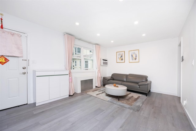 223-36 65th Ave Unit 2A, Bayside, NY 11364 - living room featuring wood finished floors, a wall mounted air conditioner, recessed lighting, and baseboards