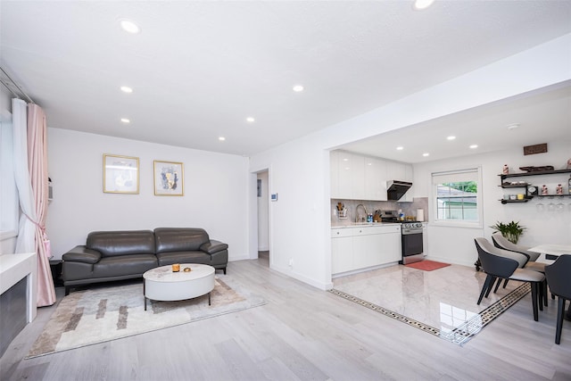 223-36 65th Ave Unit 2A, Bayside, NY 11364 - living room featuring recessed lighting, baseboards, and light wood finished floors