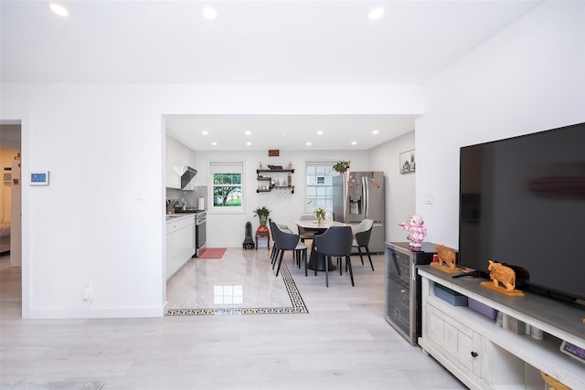 223-36 65th Ave Unit 2A, Bayside, NY 11364 - kitchen featuring stainless steel appliances, white cabinetry, recessed lighting, light countertops, and light wood-type flooring