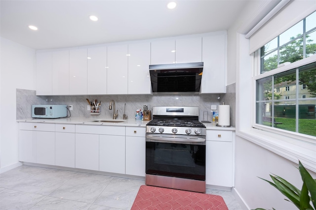 223-36 65th Ave Unit 2A, Bayside, NY 11364 - kitchen with gas range, a sink, white microwave, light marble finish flooring, and recessed lighting