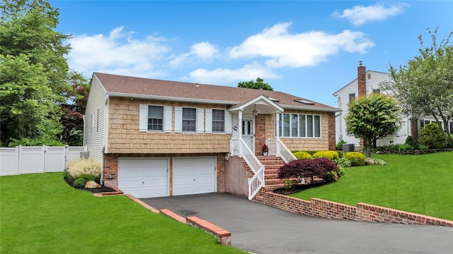 18 Commander Vic Ln, Nesconset, NY 11767 - view of front facade with driveway and an attached garage