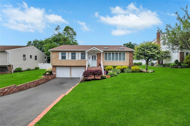 18 Commander Vic Ln, Nesconset, NY 11767 - view of front of home with an attached garage and asphalt driveway