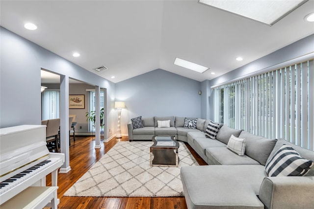 18 Commander Vic Ln, Nesconset, NY 11767 - living area with lofted ceiling, a skylight, dark wood-style floors, and recessed lighting