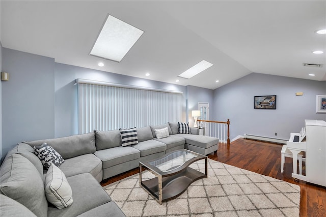18 Commander Vic Ln, Nesconset, NY 11767 - living area with a skylight, a baseboard heating unit, wood finished floors, lofted ceiling, and baseboards
