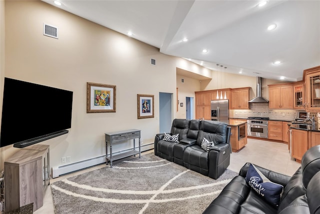 18 Commander Vic Ln, Nesconset, NY 11767 - living area featuring recessed lighting, high vaulted ceiling, and a baseboard radiator