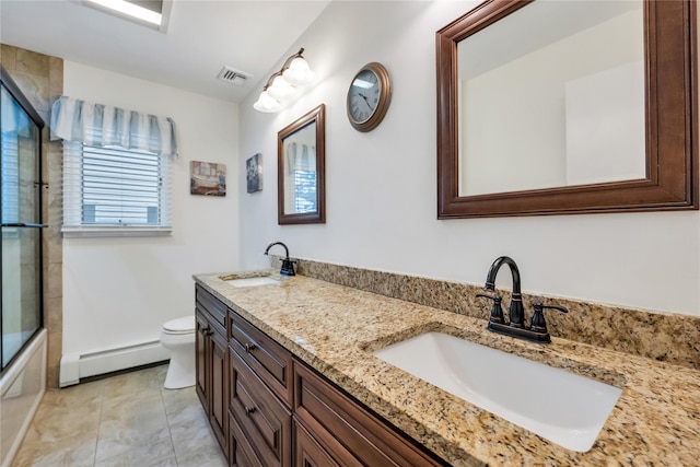 18 Commander Vic Ln, Nesconset, NY 11767 - full bathroom featuring baseboard heating, double vanity, toilet, and shower / bath combination with glass door