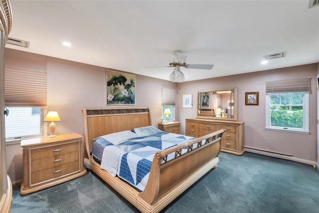 18 Commander Vic Ln, Nesconset, NY 11767 - bedroom with dark carpet, multiple windows, a baseboard radiator, recessed lighting, and ceiling fan