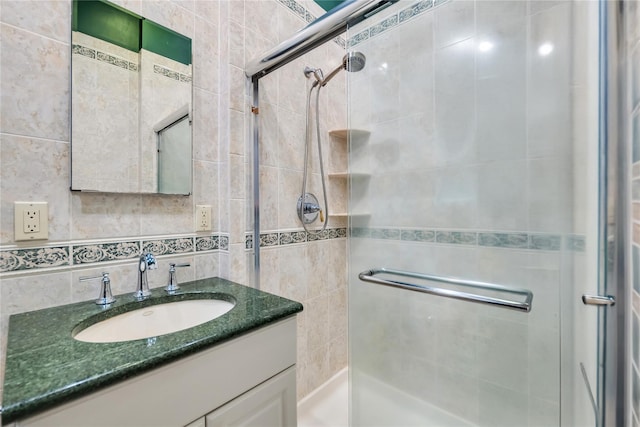 18 Commander Vic Ln, Nesconset, NY 11767 - bathroom with tile walls, a stall shower, vanity, and decorative backsplash
