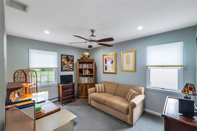 18 Commander Vic Ln, Nesconset, NY 11767 - carpeted living room with ceiling fan, baseboard heating, a desk, recessed lighting, and baseboards