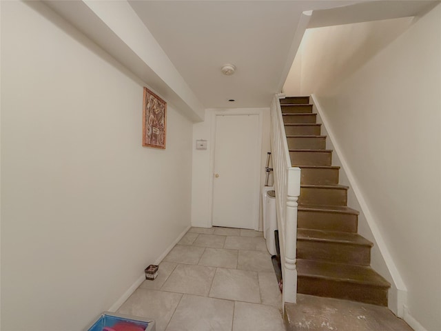 412 Newport St, Brooklyn, NY 11207 - stairs with baseboards and tile patterned floors