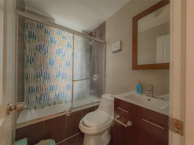 412 Newport St, Brooklyn, NY 11207 - bathroom with tile walls, tiled shower / bath, vanity, and toilet