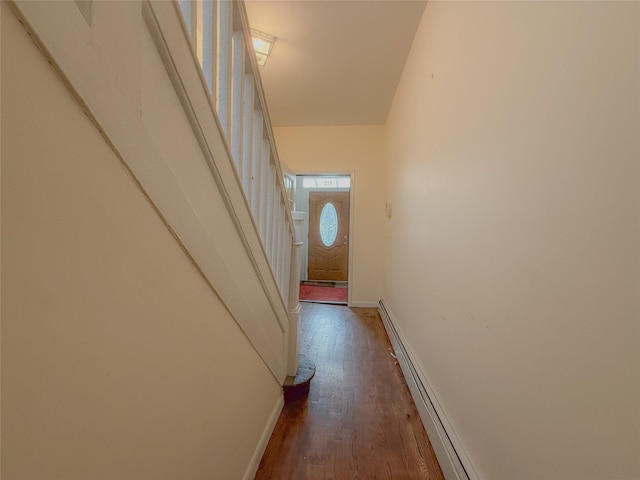 412 Newport St, Brooklyn, NY 11207 - hallway featuring wood finished floors, baseboards, stairs, and a baseboard radiator