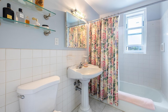 315 W 232nd St Unit 3C, Bronx, NY 10463 - bathroom featuring tile walls, toilet, shower / tub combo, and tile patterned floors