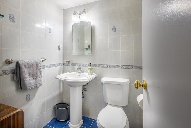 315 W 232nd St Unit 3C, Bronx, NY 10463 - half bath featuring tile walls, toilet, and tile patterned flooring