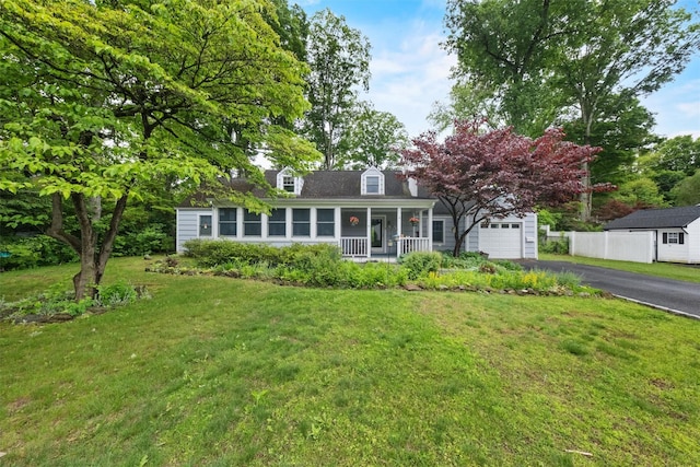 4 Hughes St, Croton-On-Hudson, NY 10520 - new england style home featuring a porch, driveway, a front yard, and a garage