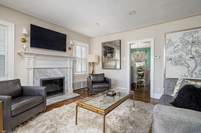 344 N Forest Ave, Rockville Centre, NY 11570 - living area with a high end fireplace, wood finished floors, baseboards, and recessed lighting